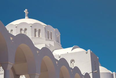 Low angle view of building against clear blue sky