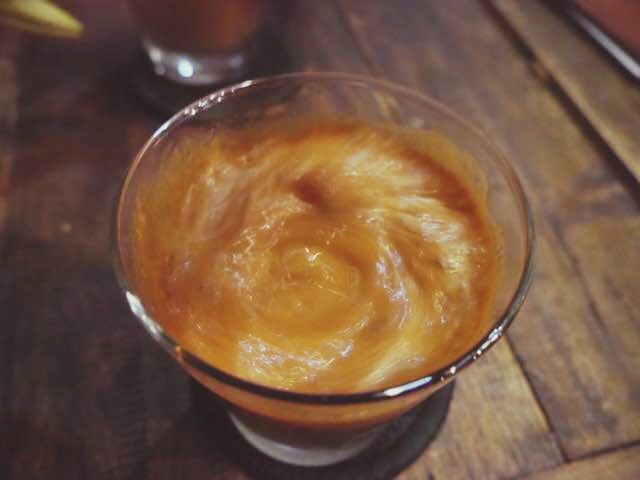 food and drink, drink, refreshment, freshness, indoors, table, still life, close-up, healthy eating, frothy drink, food, coffee - drink, drinking glass, coffee cup, focus on foreground, high angle view, no people, wood - material, cappuccino, indulgence