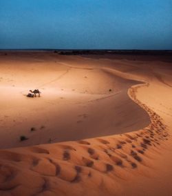 Scenic view of desert against clear sky