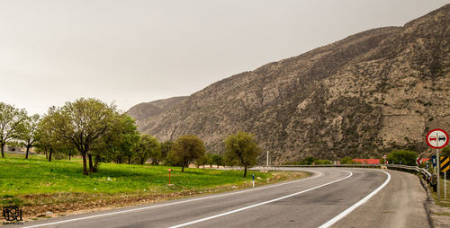 Country road passing through landscape