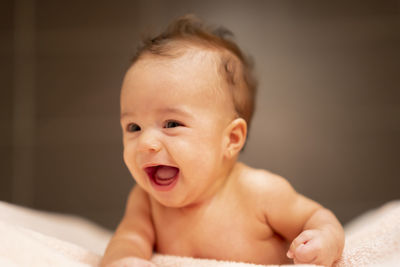 Beautiful happy girl getting out of the bathtub