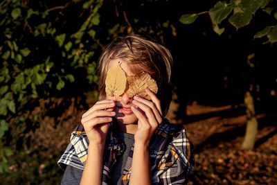 Portrait of young woman drinking water