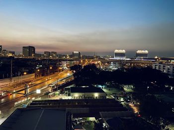 High angle view of illuminated city buildings at night