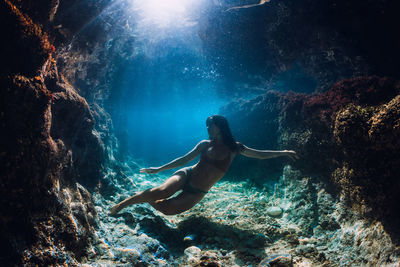 Side view of woman swimming in sea