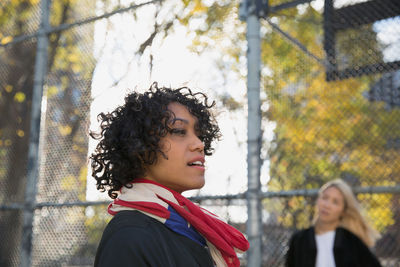 Portrait of young woman looking away