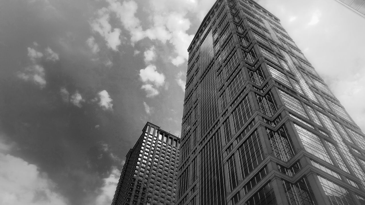 low angle view, sky, architecture, tall - high, built structure, cloud - sky, building exterior, tower, skyscraper, cloudy, modern, city, cloud, office building, day, tall, outdoors, no people, capital cities, famous place