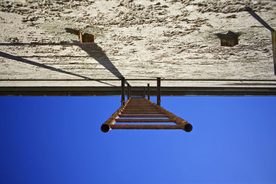 Low angle view of building against blue sky