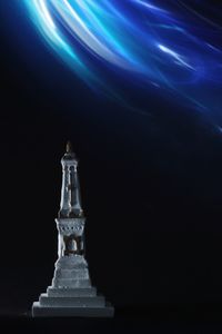 Close-up of illuminated chess against black background