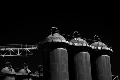 Low angle view of illuminated building against sky at night