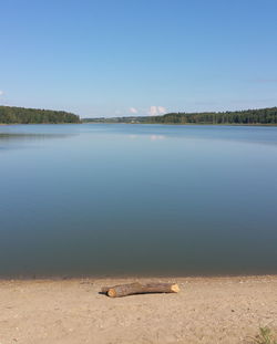 Scenic view of lake against clear blue sky