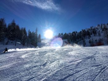 Scenic view of snow covered landscape against sky