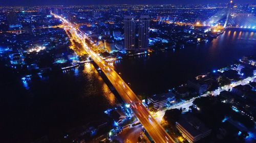 High angle view of light trails on city at night