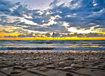 Scenic view of sea at sunset