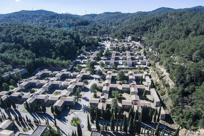 High angle view of graveyard against trees