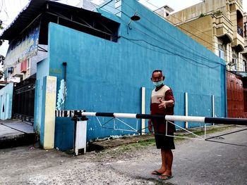 Full length of man standing on building