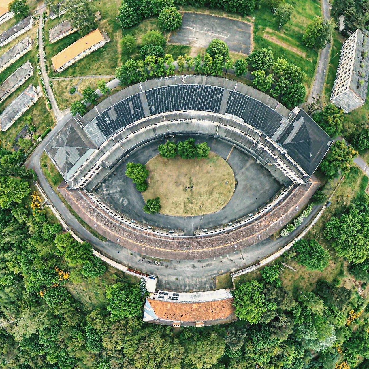 high angle view, green color, grass, growth, tree, plant, built structure, architecture, nature, formal garden, field, park - man made space, day, lush foliage, outdoors, elevated view, no people, green, garden, circle