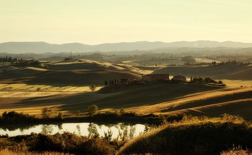 Scenic view of field against sky during sunset