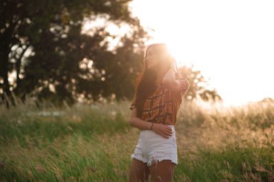 Full length of woman standing on field