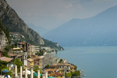 Townscape by sea against sky