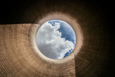 Low angle view of sky seen through hole