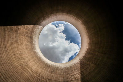 Low angle view of sky seen through chimney