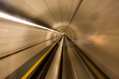 Blurred motion of train moving in tunnel