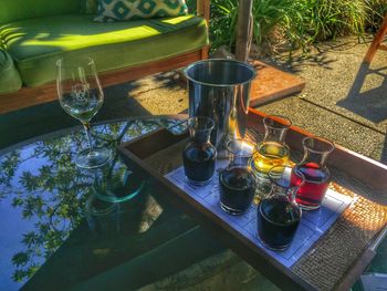 Glass of wine bottles on table