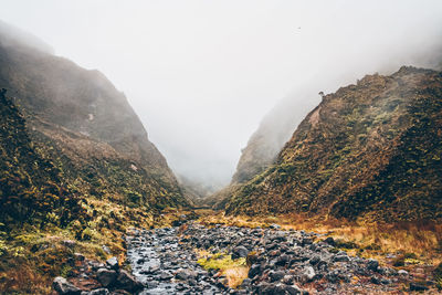 Scenic view of mountains against sky during winter