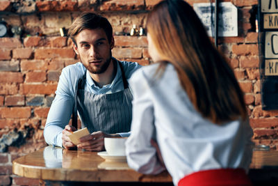 Young couple with coffee in cafe