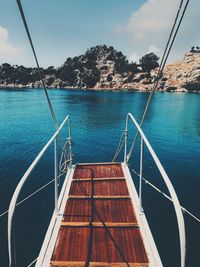 Boat moored on sea against sky