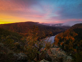 Scenic view of mountains against sky during sunset