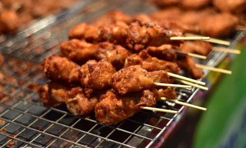 High angle view of meat on barbecue grill