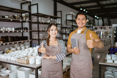 Portrait of smiling friends standing in store