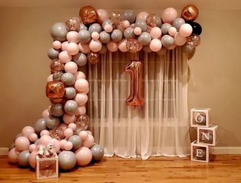 Close-up of balls on table against wall at home