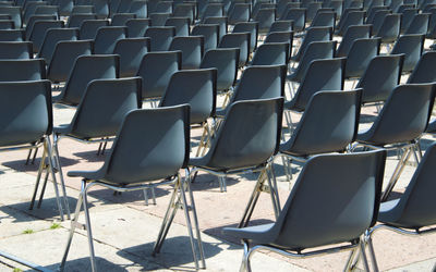 Full frame shot of empty chairs arranged outdoors