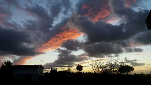 Low angle view of dramatic sky during sunset