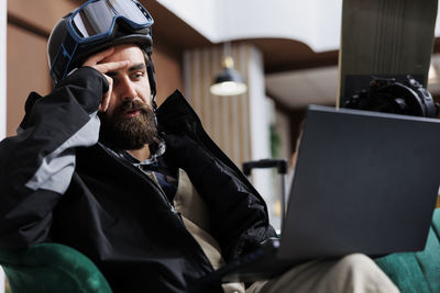 Man using laptop at home