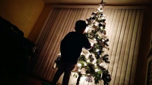 Low angle view of christmas tree at home