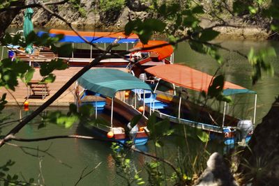 Boats moored in lake