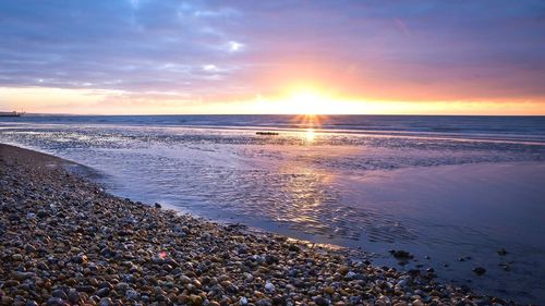 Scenic view of sea against sky during sunset