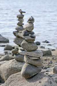 Stacks of rocks beside a body of water