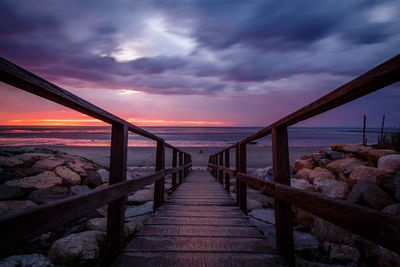 Scenic view of beach against sky during sunset