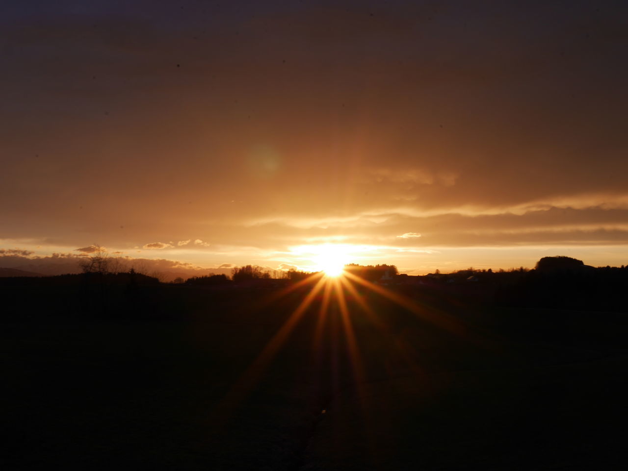 SILHOUETTE LANDSCAPE AGAINST SUNSET SKY