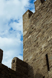 Low angle view of old building against sky