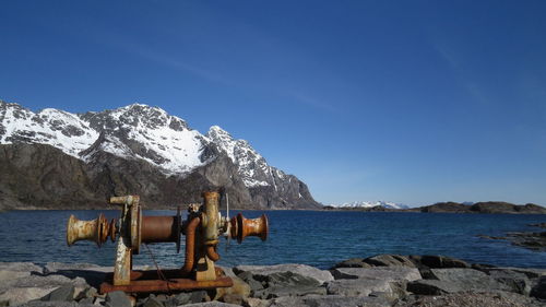 Scenic view of sea against clear blue sky