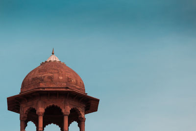 Low angle view of historic building against clear blue sky