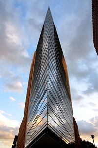 Low angle view of skyscraper against sky