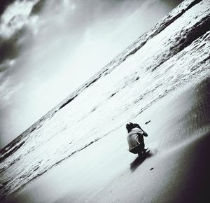 Full length of woman standing on beach