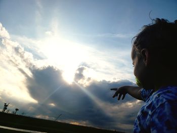 Portrait of girl against sky during sunset