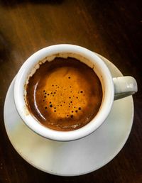 High angle view of coffee cup on table